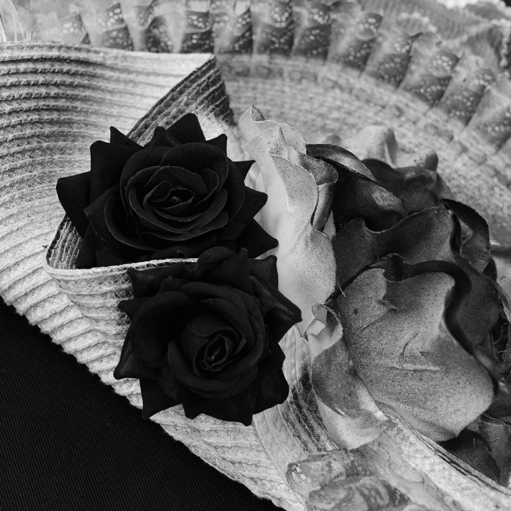 Elegant Black and White Floral Fascinator Hat with Feathers